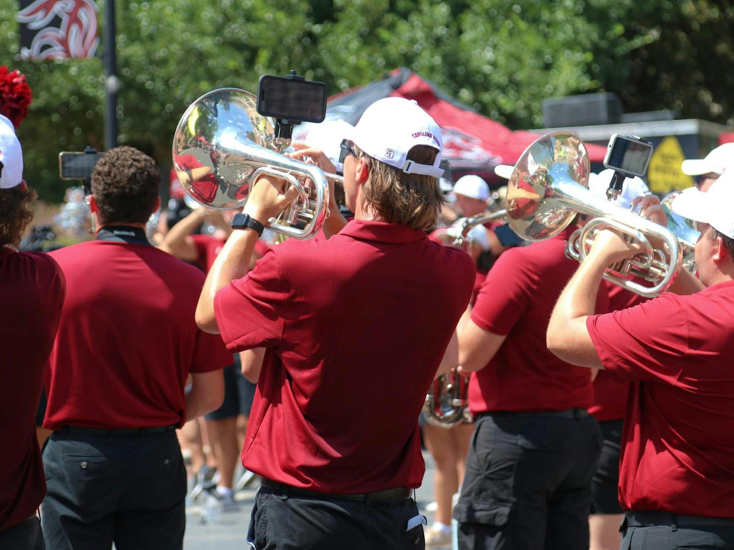 FILE — A Carolina Band member plays their instrument during the Carolina Kickoff event on Greene Street on Aug. 30, 2024. The band played a variety of songs from its typical game-day lineup to prepare students for the first home football game of the season.