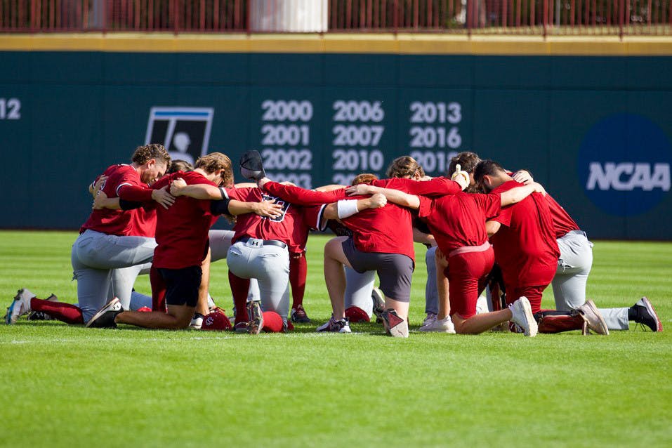 The Garnet team huddles together in the outfield giving brief speeches before its scrimmage against the Black team on Nov. 5, 2022. The South Carolina baseball team held a intrasquad scrimmage in front a small crowd to prepare themselves for its upcoming season.