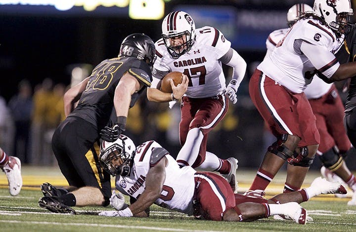 South Carolina Gamecocks quarterback Dylan Thompson (17) runs for a first down during the first quarter against Missouri at Memorial Stadium&apos;s Faurot Field in Columbia, Missouri, on Saturday, October 26, 2013. (Gerry Melendez/The State/MCT)