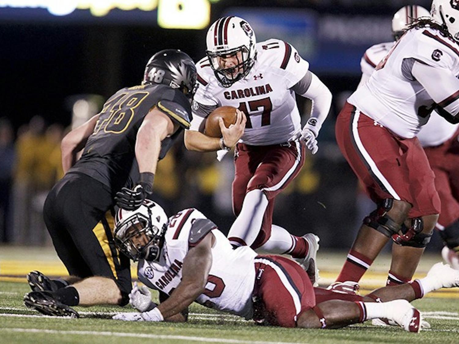South Carolina Gamecocks quarterback Dylan Thompson (17) runs for a first down during the first quarter against Missouri at Memorial Stadium&apos;s Faurot Field in Columbia, Missouri, on Saturday, October 26, 2013. (Gerry Melendez/The State/MCT)
