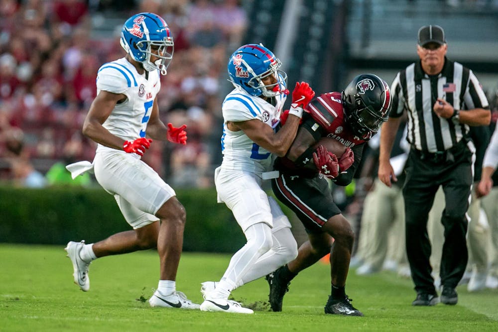 <p>FILE — Freshman wide receiver Mazeo Bennett Jr. is wrapped up by an Ole Miss defender during South Carolina's game on Oct. 5, 2024 at Williams-Brice Stadium. The Gamecocks are set to play the Rebels on Nov. 1, 2025 in Oxford, Mississippi.</p>