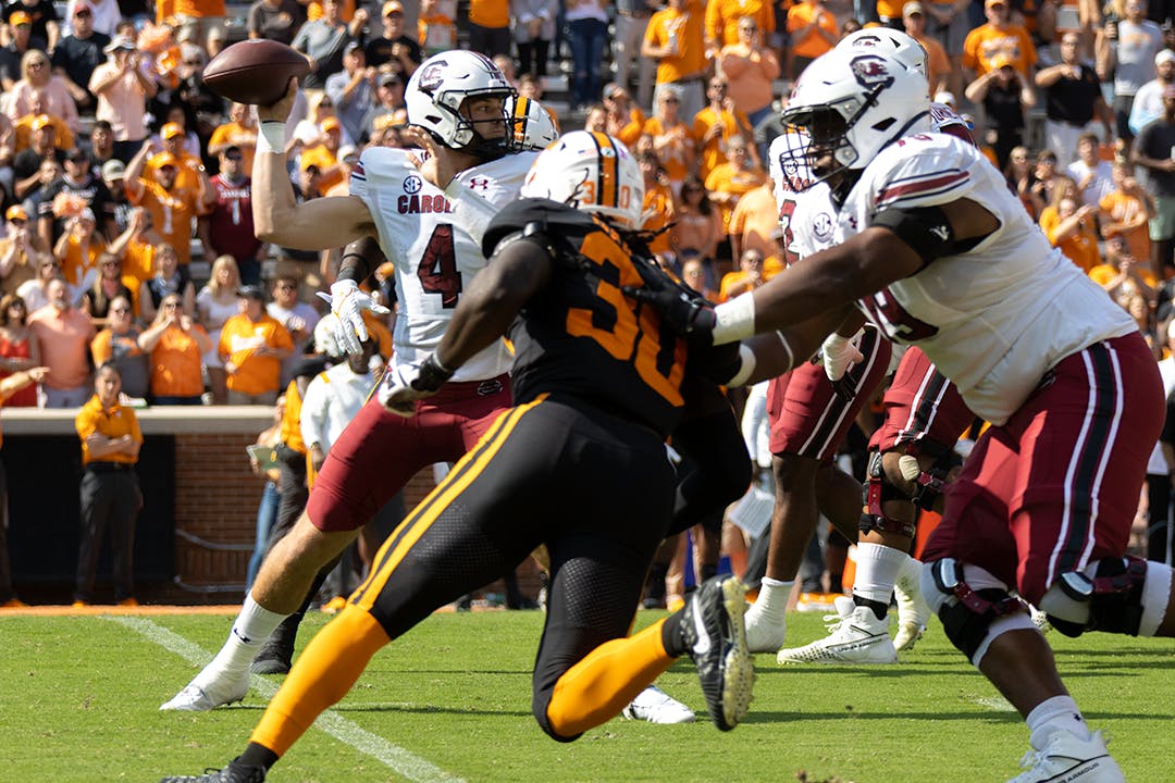 Sophomore quarterback Luke Doty searches for an open receiver before snapping the ball. During this game, Doty made 167 passing yards bringing his total for the season to 733 as of Oct. 9, 2021.