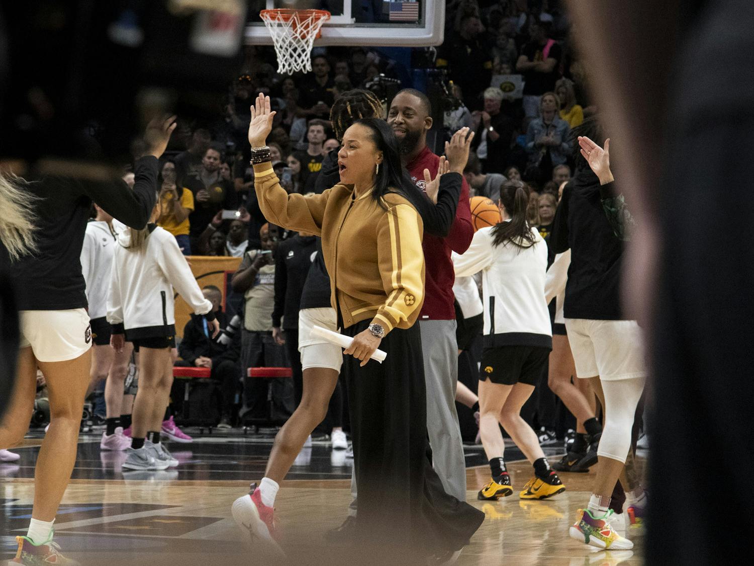 Head coach Dawn Staley gives a high-five to freshman forward Chloe Kitts during warm-ups against the University of Iowa at the Women's Final Four match on March 31, 2023. The Gamecocks lost to the Hawkeyes 77-74