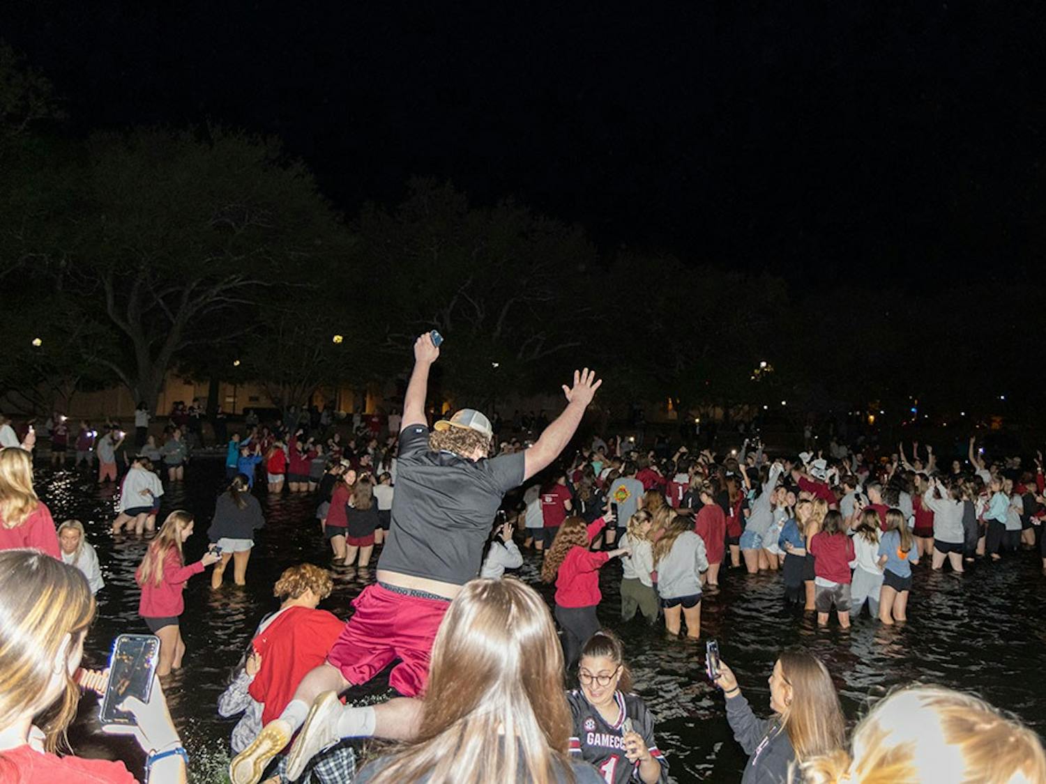 A sea of Gamecock fans in the reflection pond outside Thomas Cooper Library. This follows the women's basketball team winning the national championship on April 3, 2022 in Columbia, SC.&nbsp;