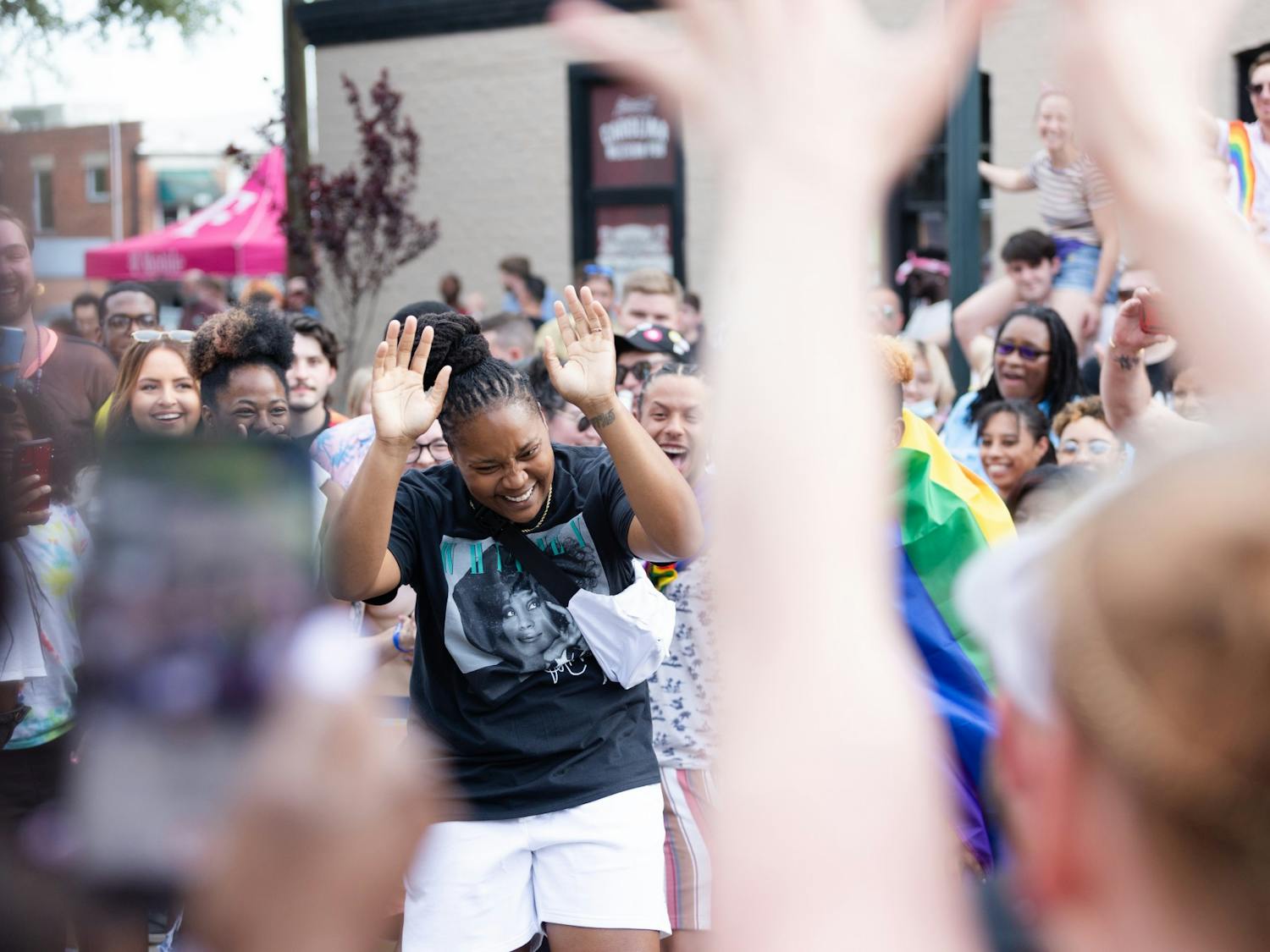 An Outfest attendee shows off their moves as a dance circle breaks out on Park Street on June 4, 2022. Outfest featured performances, food and vendors in honor of Pride month.