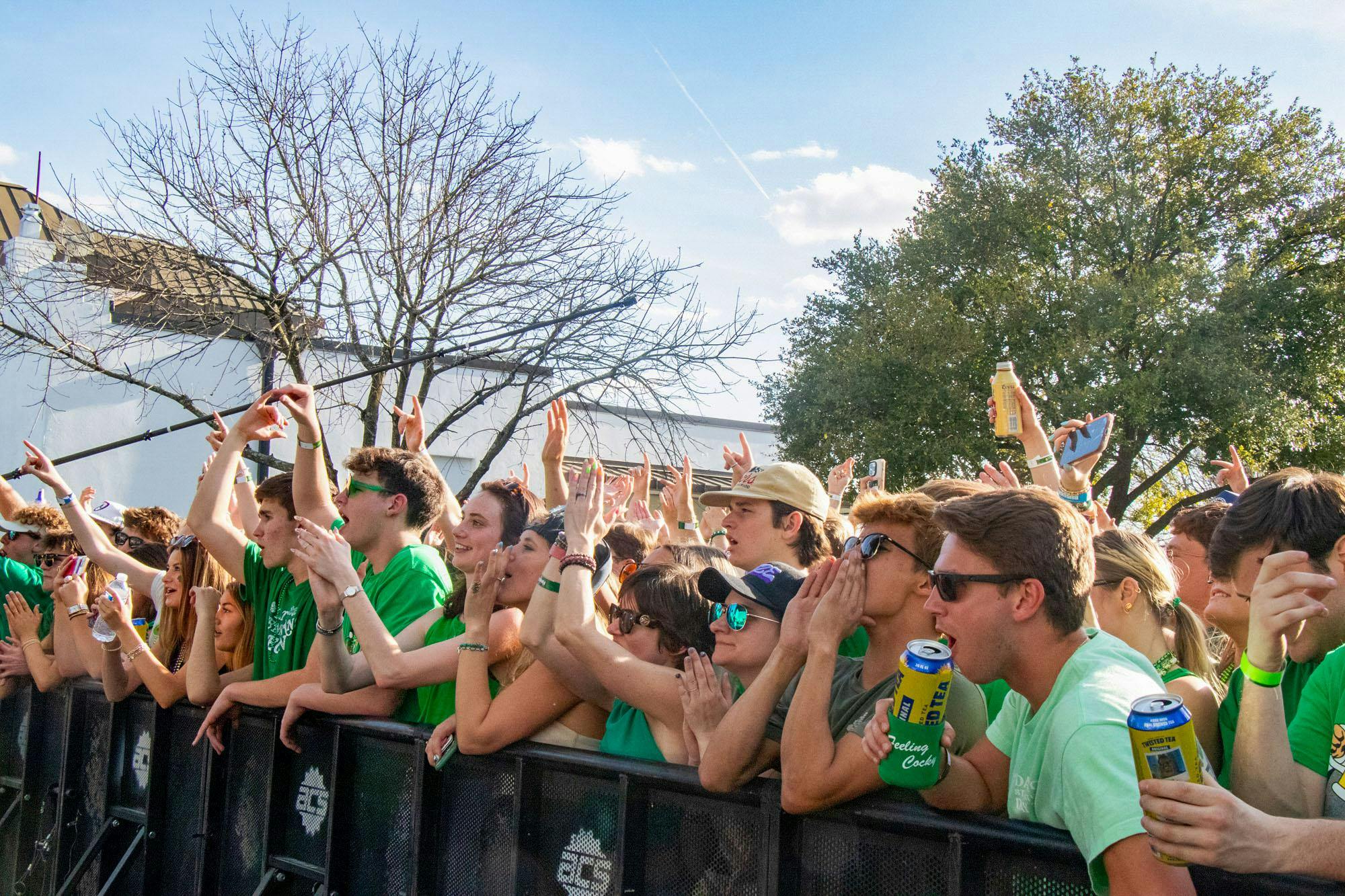 Spectators cheer as the band Futurebirds plays on the Greene Stage during St. Pat's in Five Points in Columbia, South Carolina, on March 16, 2024. Futurebirds was one of five bands to take the Greene Stage throughout the day.