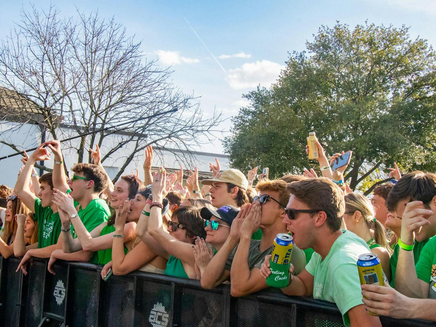 Spectators cheer as the band Futurebirds plays on the Greene Stage during St. Pat's in Five Points in Columbia, South Carolina, on March 16, 2024. Futurebirds was one of five bands to take the Greene Stage throughout the day.