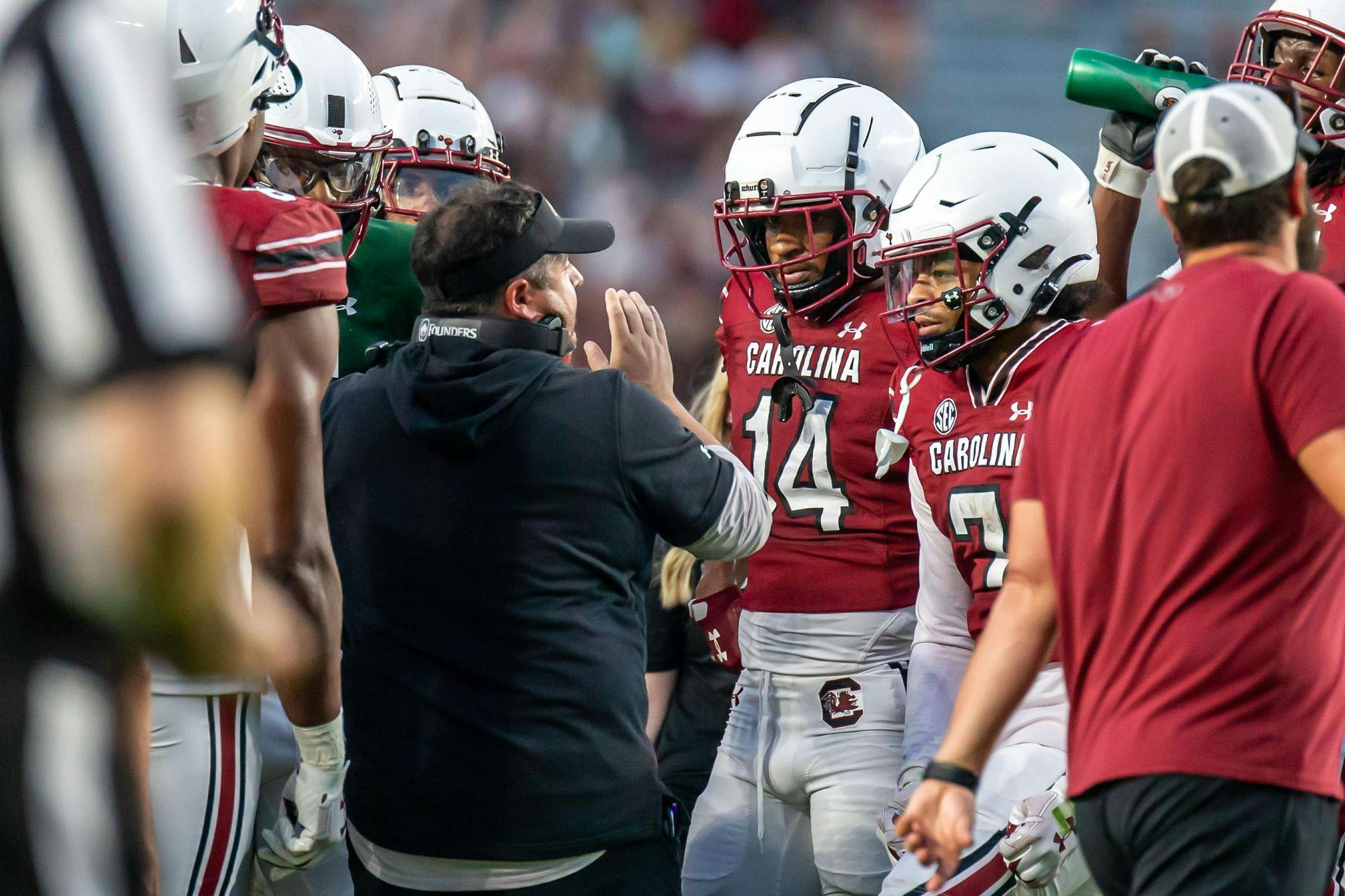FILE — Redshirt junior wide receiver Jared Brown and senior wide receiver Gage Larvadain listen to Offensive Coordinator and Quarterbacks Coach Dowell Loggains during South Carolina's annual Garnet and Black Spring Game at Williams-Brice Stadium on April 20, 2024. 2024 marks both players’ first season playing for the Gamecocks.