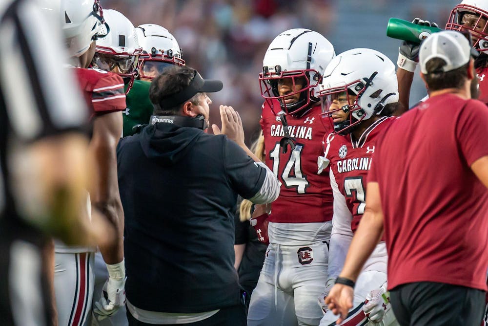 <p>FILE — Redshirt junior wide receiver Jared Brown and senior wide receiver Gage Larvadain listen to Offensive Coordinator and Quarterbacks Coach Dowell Loggains during South Carolina's annual Garnet and Black Spring Game at Williams-Brice Stadium on April 20, 2024. 2024 marks both players’ first season playing for the Gamecocks.</p>