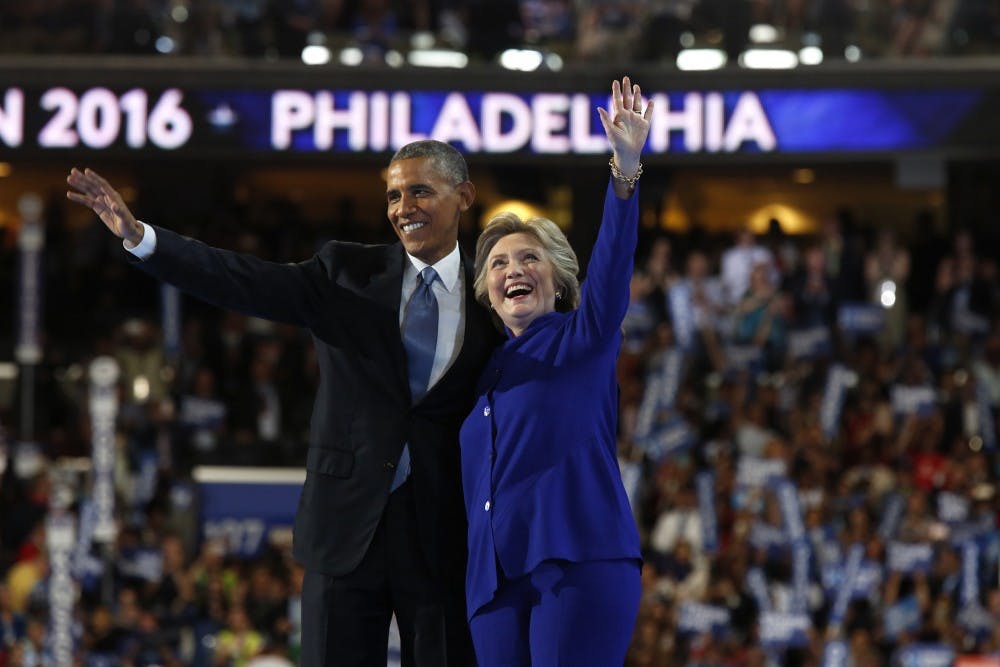 President Obama and Democratic presidential nominee Hillary Clinton on stage during the third day of the Democratic National Convention at the Wells Fargo Center in Philadelphia on Wednesday, July 27, 2016. (Carolyn Cole/Los Angeles Times/TNS)