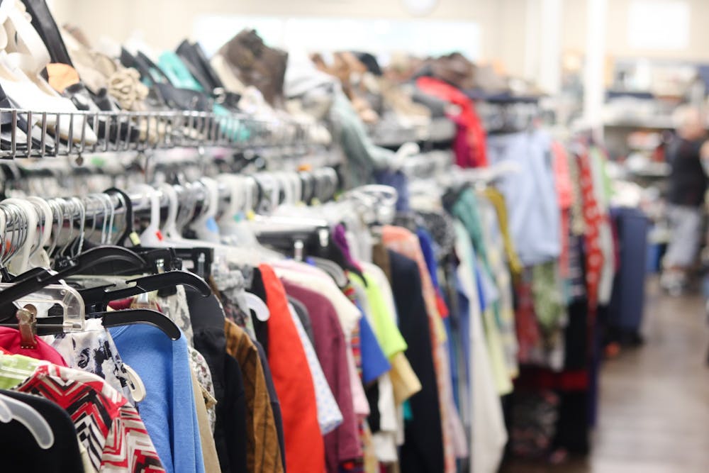 <p>Blouses and other clothes hanging on a rack at His House Ministries Thrift Store on Tuesday, July 19, 2022. This store in West Columbia is one of three locations in the Midlands.&nbsp;</p>