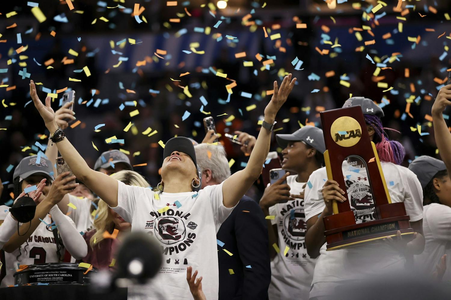 Head coach Dawn Staley takes in the confetti after South Carolina won the National Championship, defeating the Huskies 64-49 on April 3, 2022.