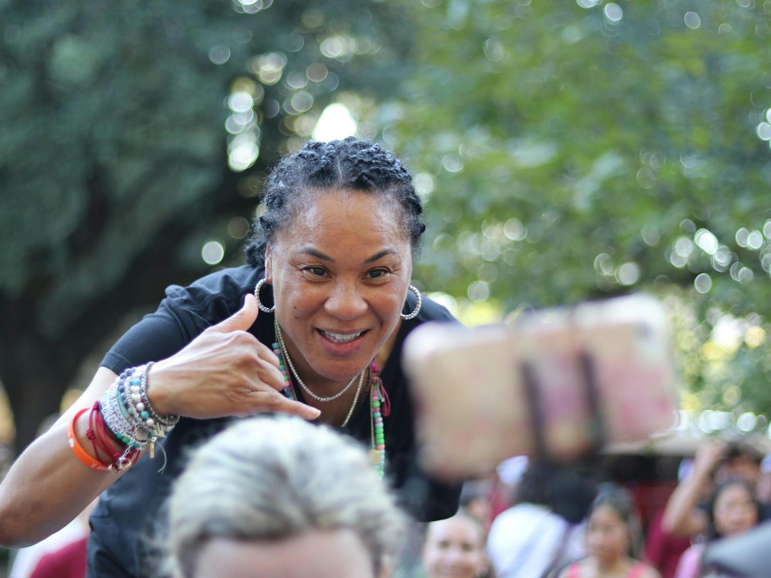 Women’s basketball head coach Dawn Staley poses for a photo with a student after addressing the crowd at First Night Carolina on Aug. 19, 2024. Staley was joined by Shane Beamer, Lamont Paris and university President Michael Amiridis to welcome students back to campus.