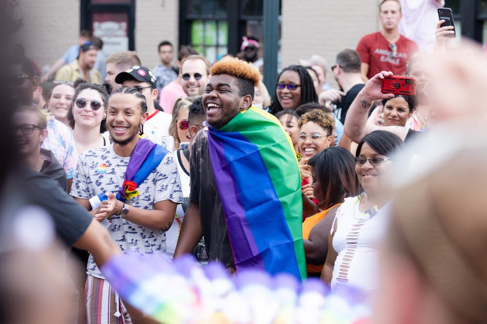 <p>An Outfest attendee laughs as a dance circle breaks out on Park Street on June 4, 2022. Outfest featured performances, food and vendors in honor of Pride month.&nbsp;</p>
