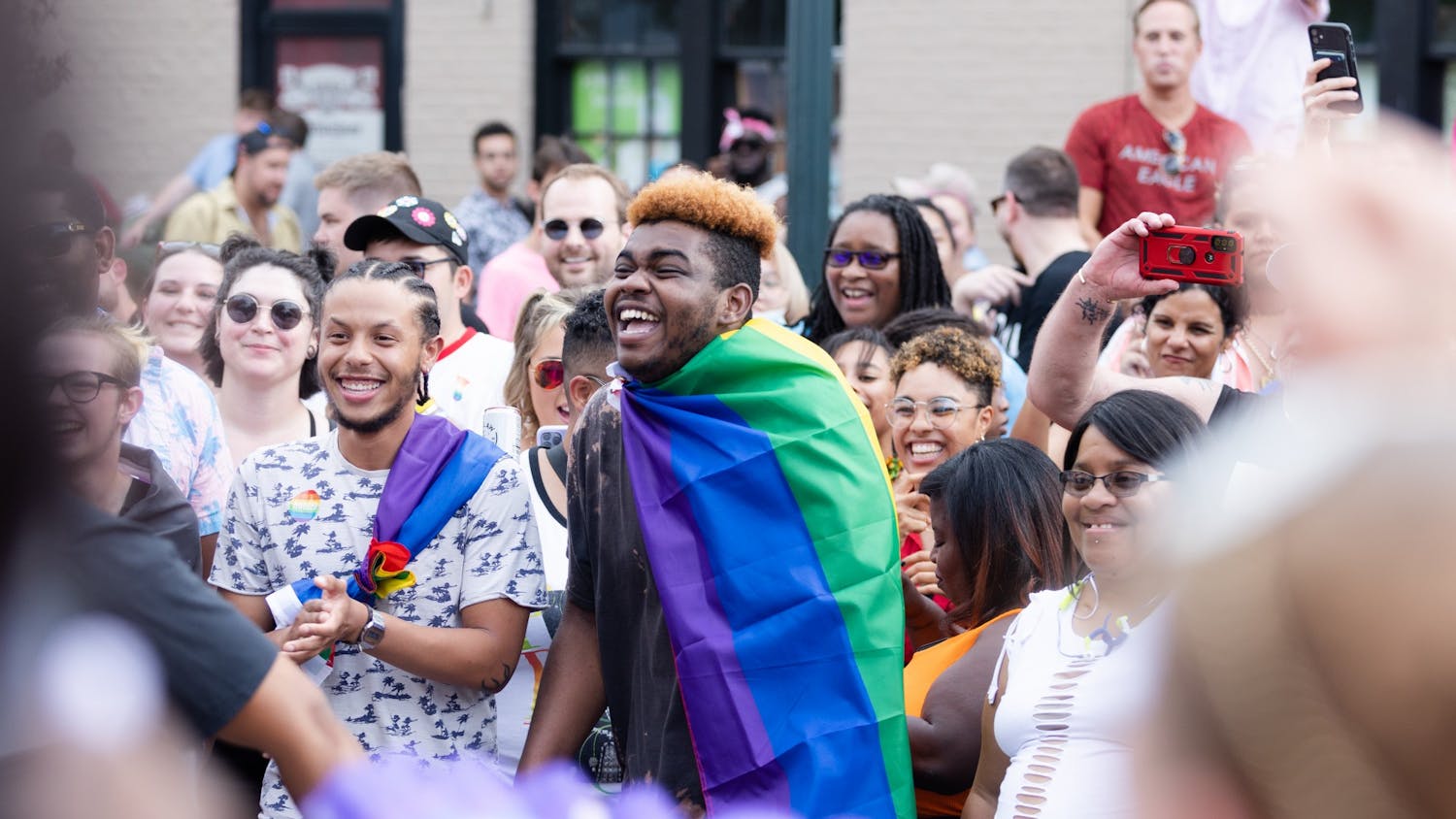 An Outfest attendee laughs as a dance circle breaks out on Park Street on June 4, 2022. Outfest featured performances, food and vendors in honor of Pride month.&nbsp;