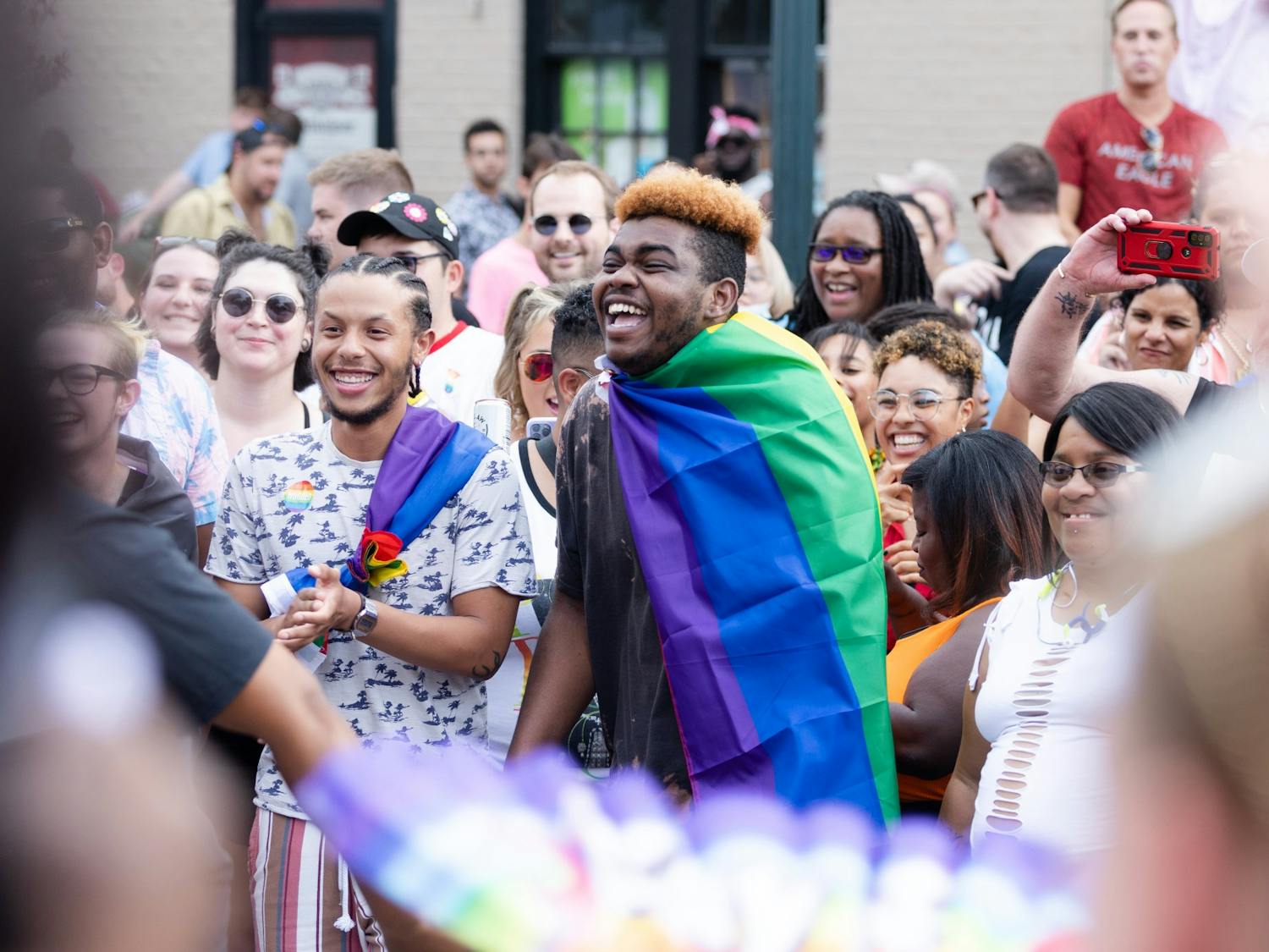 An Outfest attendee laughs as a dance circle breaks out on Park Street on June 4, 2022. Outfest featured performances, food and vendors in honor of Pride month. 