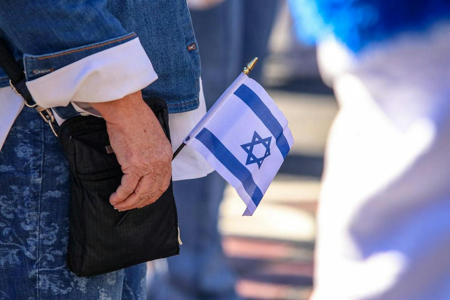 A rally attendee holds a miniature Israeli flag to show support during a pro-Israel event on Dec. 7, 2023. Members of the Gamecocks for Israel organization hosted the rally on Greene Street.