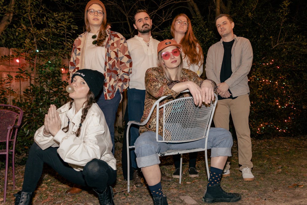 <p>The Charlie Boy band poses for a group photo on Jan. 26, 2022. Top row, left to right: Emily McCollum (Drummer), Gabe Crawford (Guitar), Lanier S. (Bass) and Tyler Gordon (Guitar). Bottom row, left to right: Catherine Hunsinger (Cello) and Kat Hammond (Lead/ Guitar).&nbsp;</p>