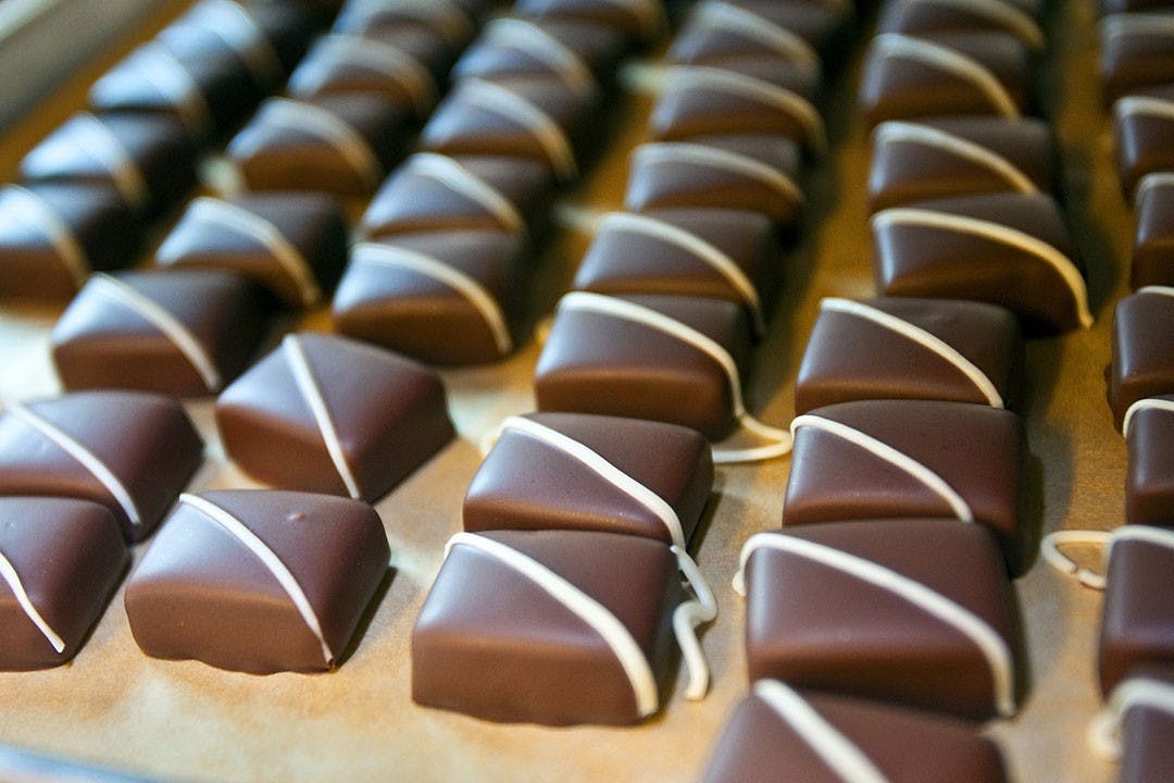 Organic, fair-trade Theo chocolates are stored on trays after cooling in Freemont, Washington