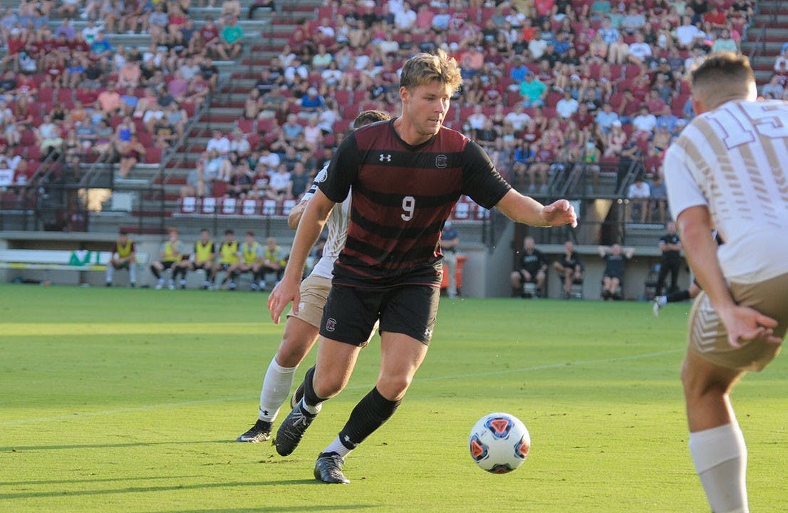 Sophomore defender Christian Kraus receives a pass from a teammate during the season opener against the College of Charleston Cougars. The Cougars beat the Gamecocks 1-0 with a goal during overtime.&nbsp;