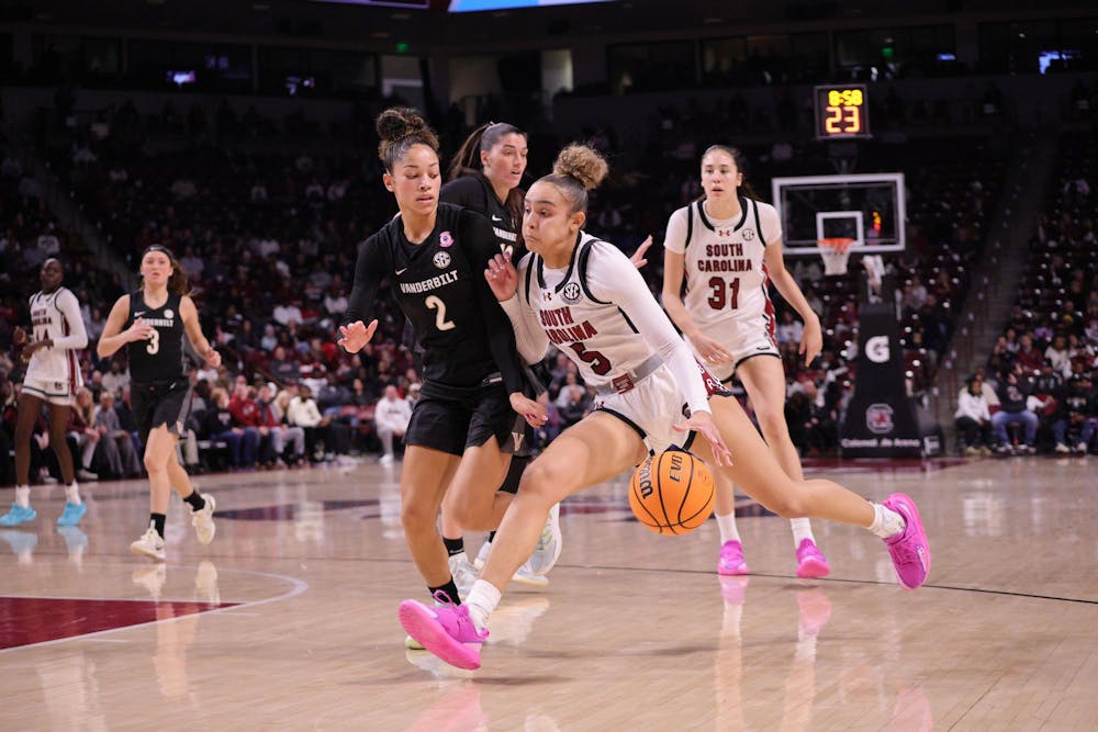<p>FILE — Junior guard Tessa Johnson dribbles the ball during the Gamecocks’ matchup with Vanderbilt at Colonial Life Arena on Jan. 25. She moves past a defender as she heads toward the basket.</p>