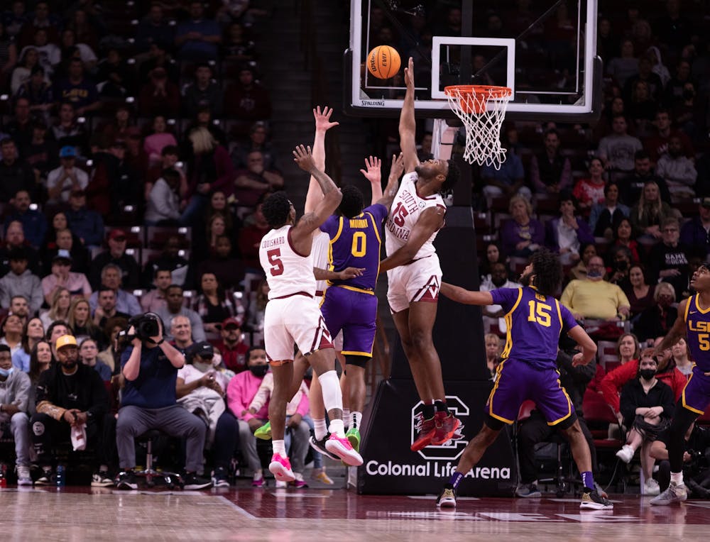 <p>South Carolina junior forward Wildens Leveque and redshirt junior Jermaine Couisnard jump to guard the basket during the first half on Feb. 19, 2022. USC defeated LSU 77-75 after a 33-point game from Couisnard.</p>