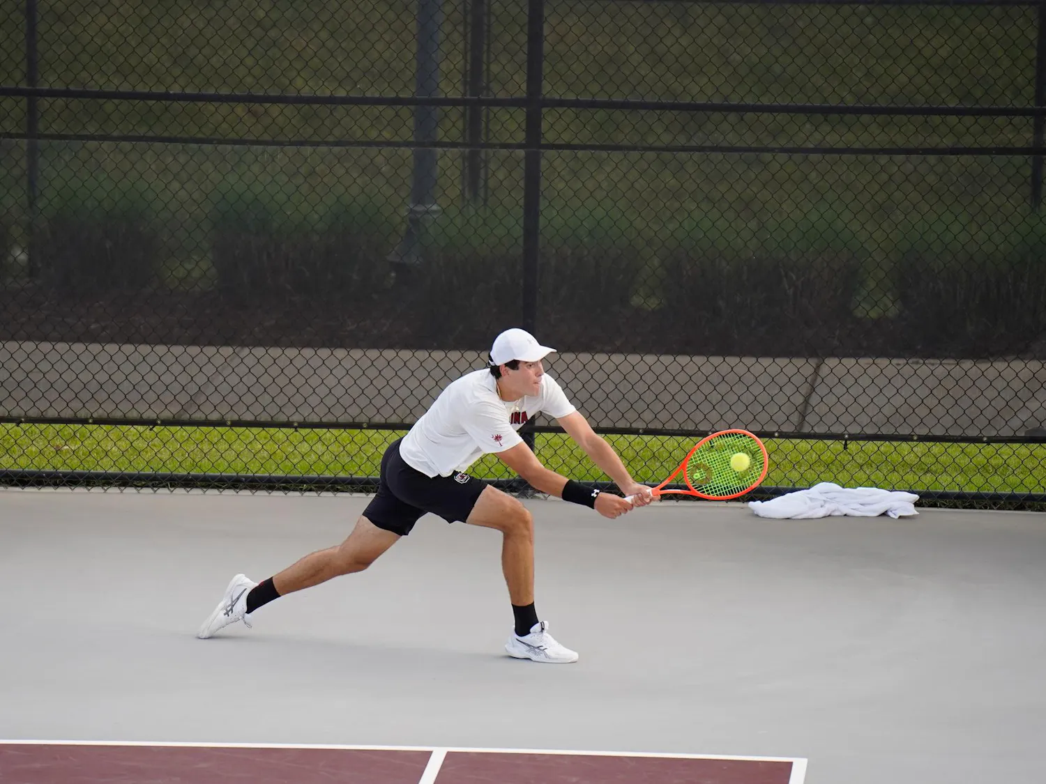 Senior Lucas Andrade da Silva returns a hit in his singles matchup against Vanderbilt at the Carolina Tennis Center on Apr. 4, 2026. Silva lost sets one and two 7-5 and 5-2.