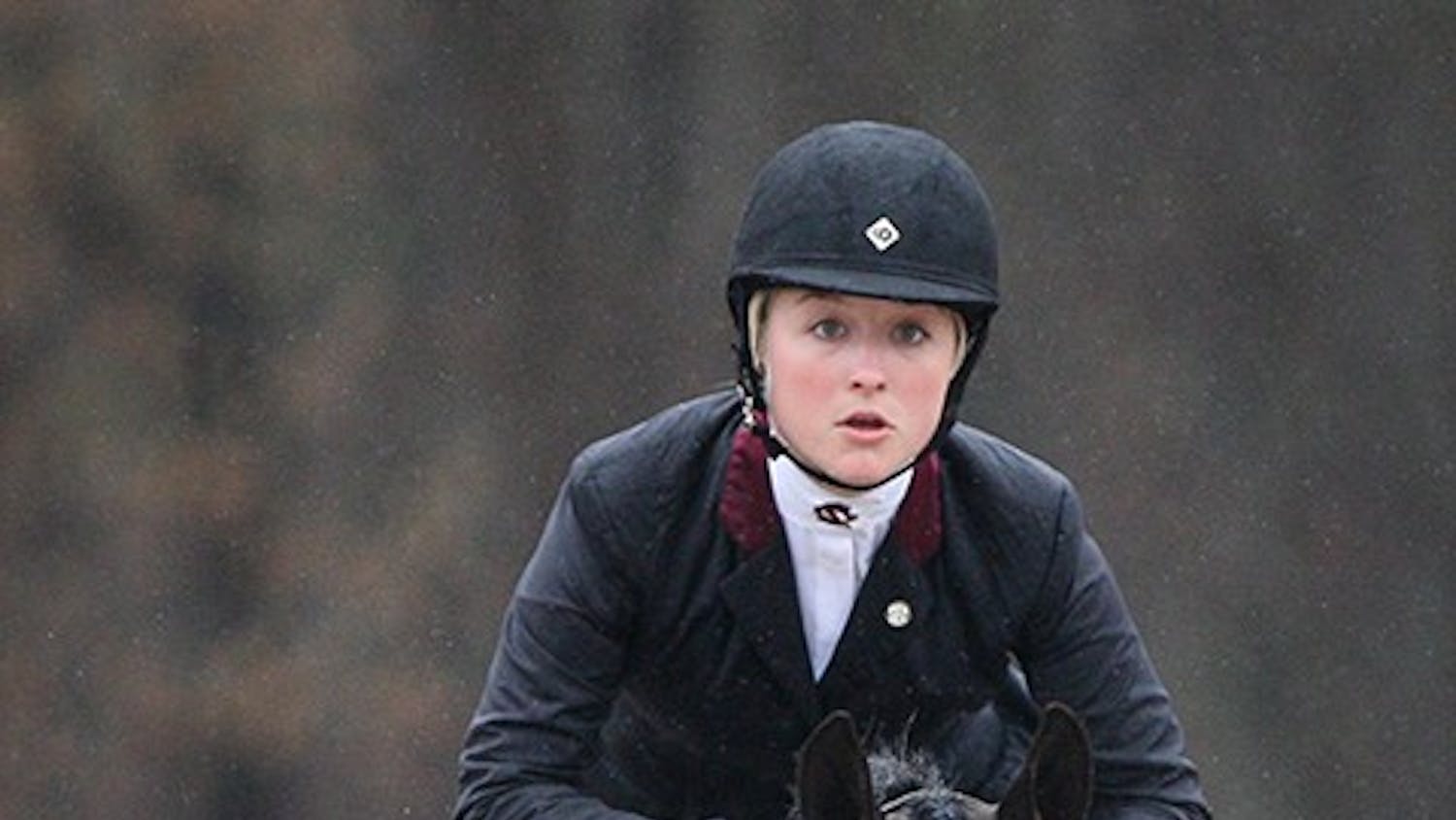 South Carolina's Amber Henter competes in Equitation Over Fences during the SEC Equestrian championships against Georgia at One Wood Farm in Blythewood, S.C., Saturday, March 29, 2014. (C Michael Bergen/The State/MCT)