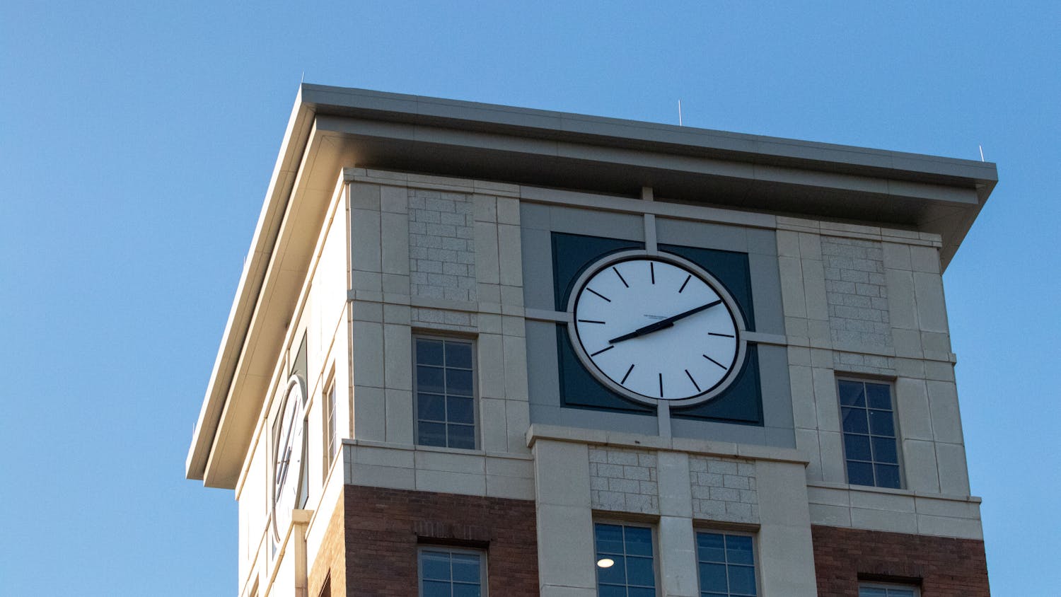 A picture of the clock tower that sits on top of Campus Village Building 1. There are four new buildings in Campus Village that house over 1,800 students.