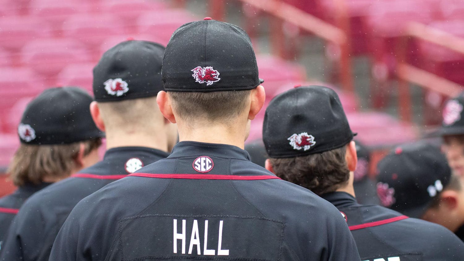 Junior outfielder Nathan Hall listens to Coach Paul Mainieri’s pregame speech before the game against Queens on Feb 19. 2025 at Ray Tanner Field in Founders Park. The Gamecocks beat the Royals 7-2 with a total of 12 hits.