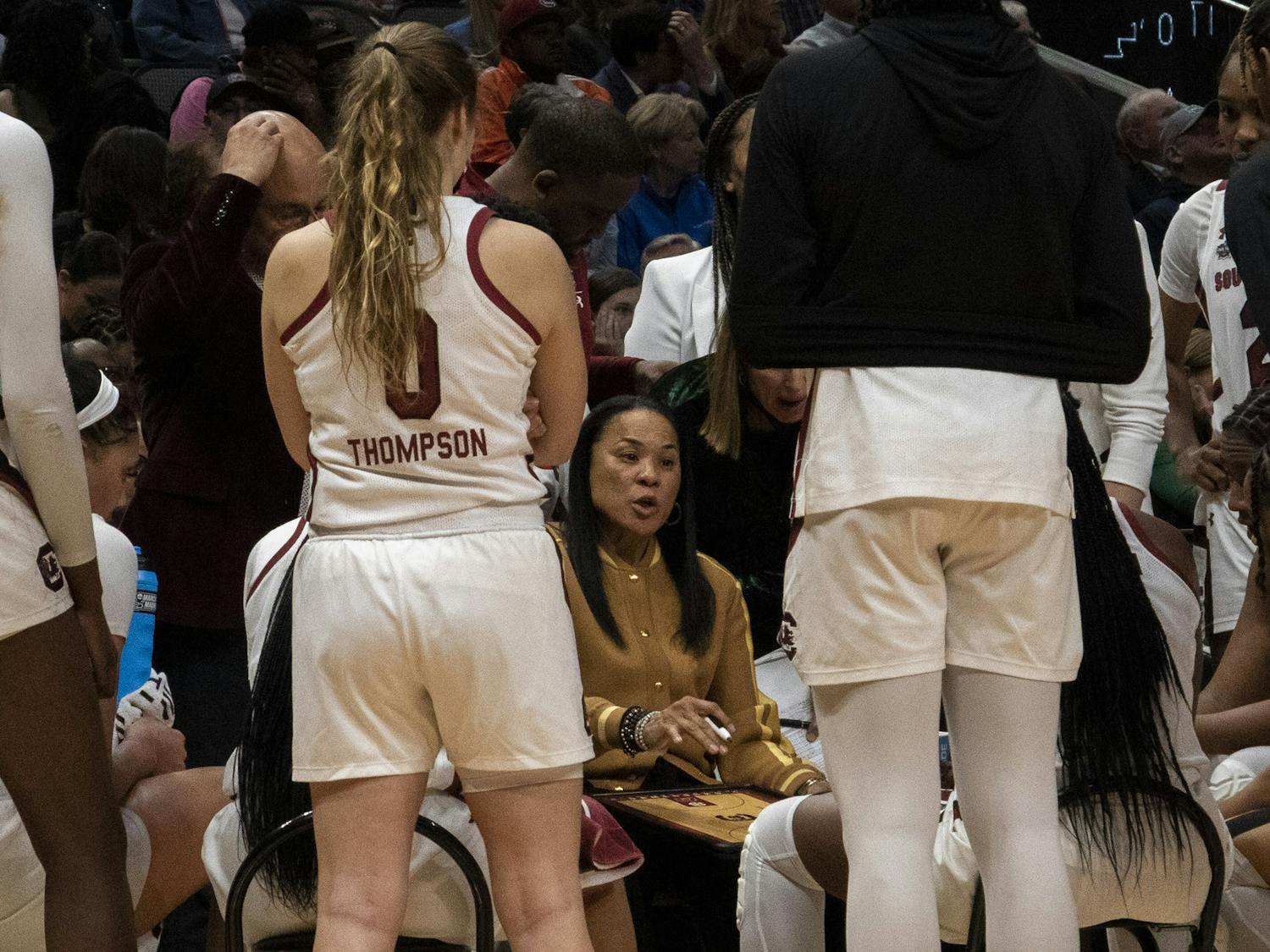 Head coach Dawn Staley pulls her team together for a timeout during the second half to keep them calm and collected during the Women’s Final Four match on March 31, 2023. Staley was just named back-to-back Naismith Women's Coach of the Year.&nbsp;