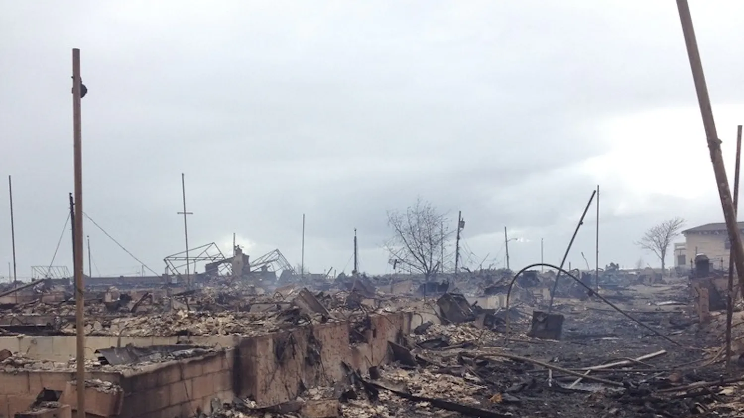 Neighborhood of burnt houses in Breezy Point, NY.
