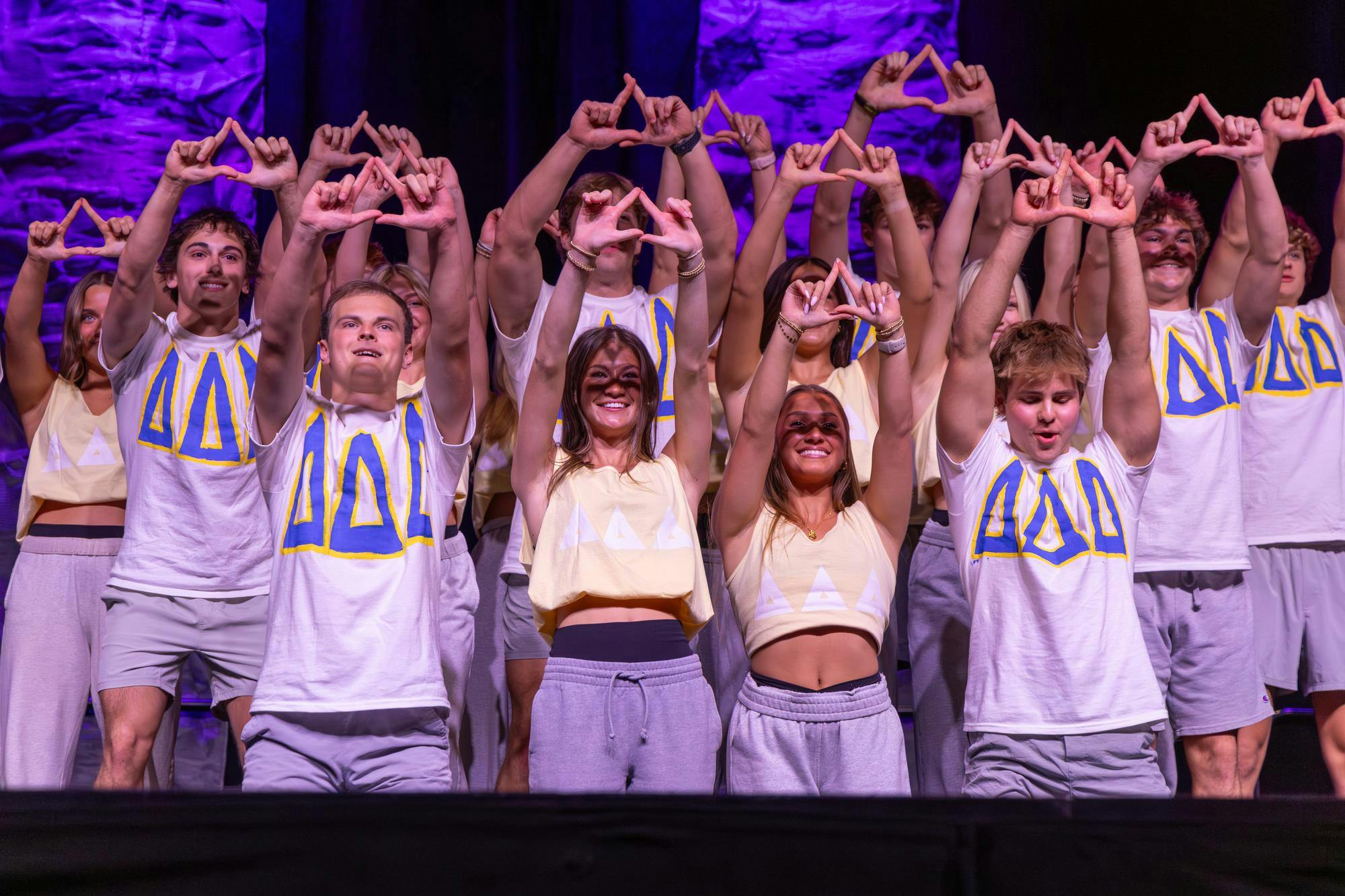 Members of Delta Delta Delta and Kappa Sigma hold up hand signs at the start of their dance routine for Spurs &amp; Struts on Oct. 22, 2025, at the Columbia Metropolitan Convention Center. Spurs &amp; Struts is hosted annually by the Homecoming Board and Gamecock Entertainment.
