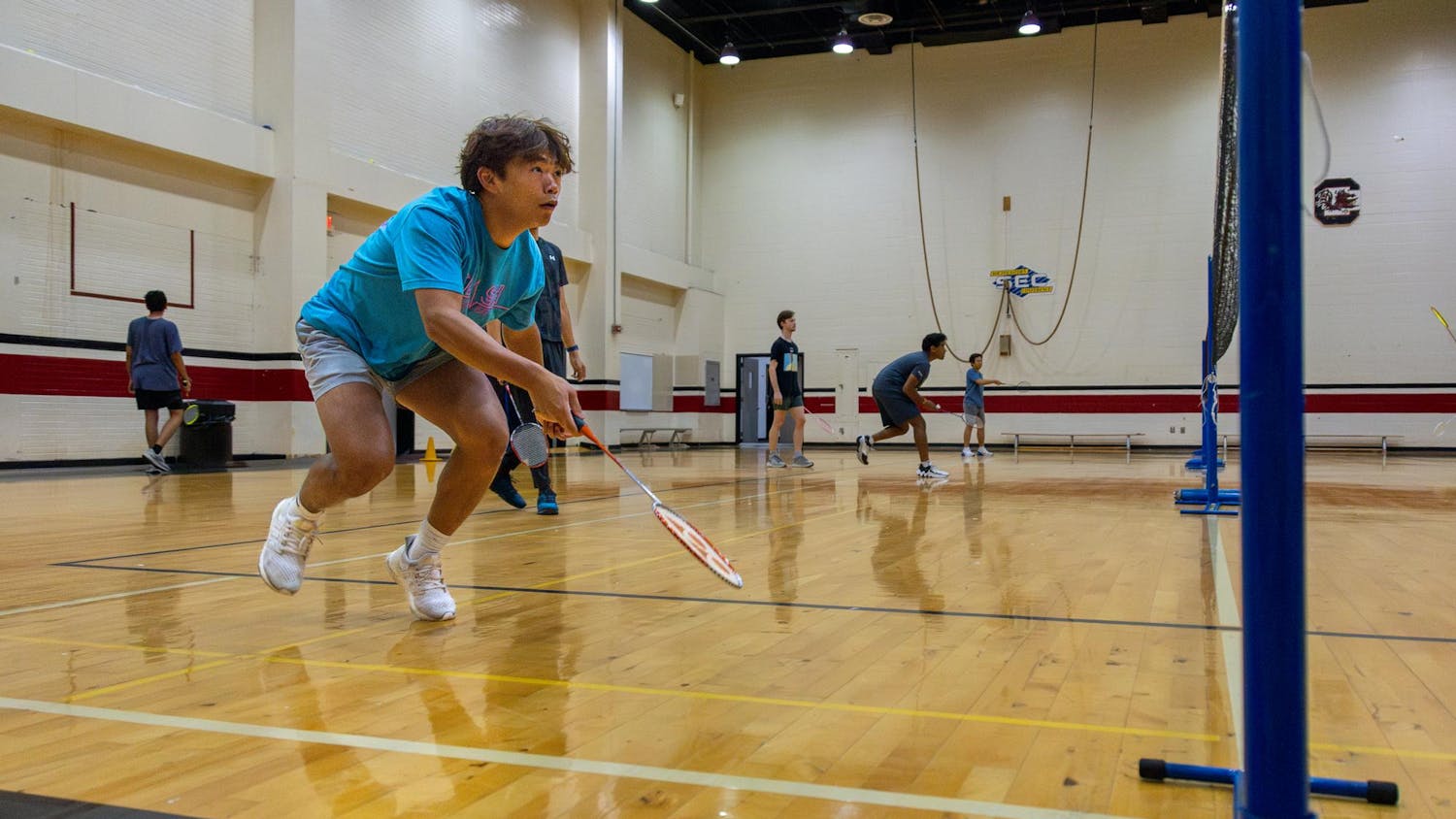 Fourth-year public health student Dylan Dang prepares to return the birdie during club badminton practice on Sept. 11, 2024. Club Badminton practices on Wednesday and Thursday Nights at Blatt Public Education Center.