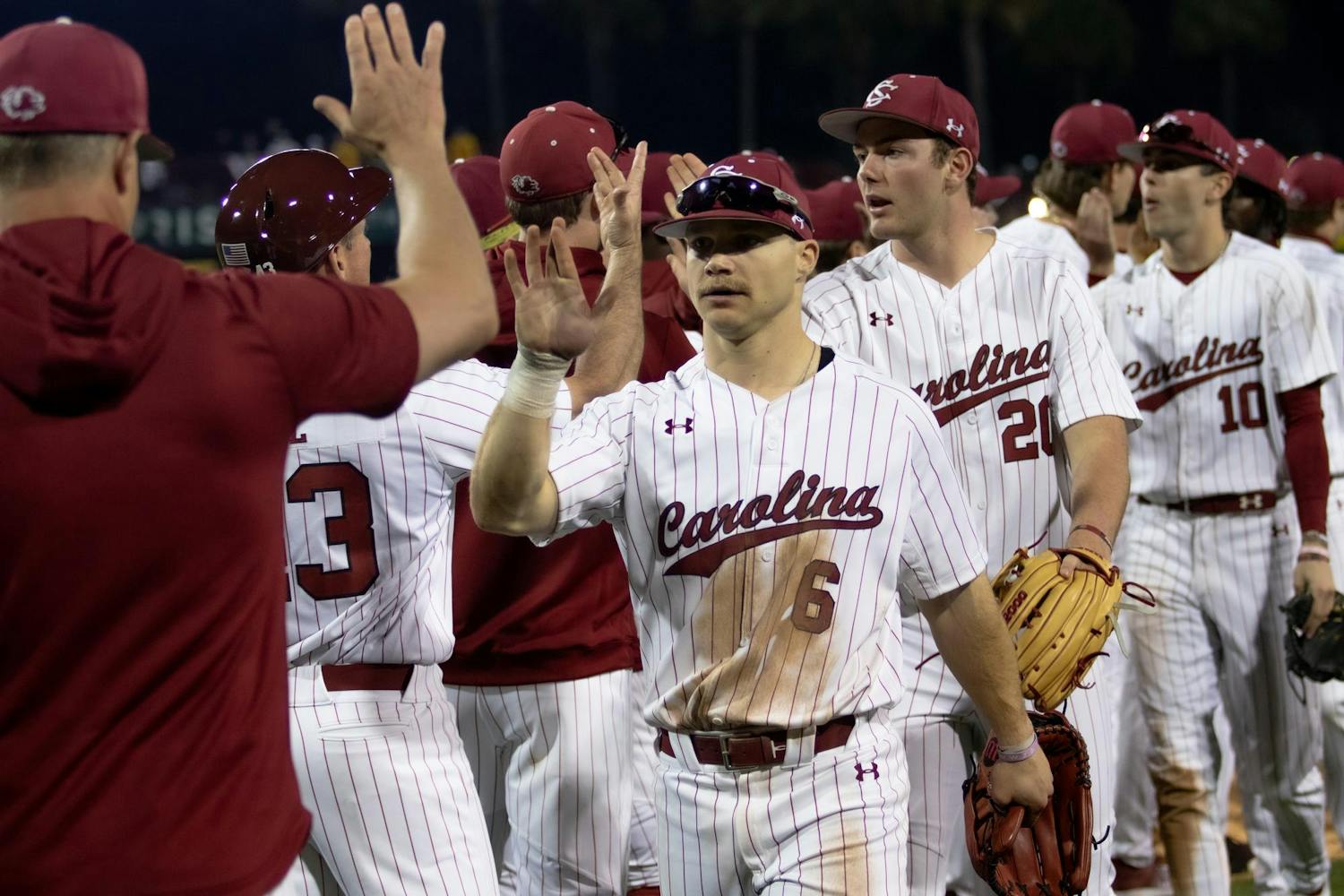 Junior outfielder Blake Jackson high-fives his teammates after the Gamecocks' 5-1 victory over Miami-Ohio on Feb. 16, 2024 at Founders Park. Jackson totaled three hits during the Gamecocks' opening weekend series.