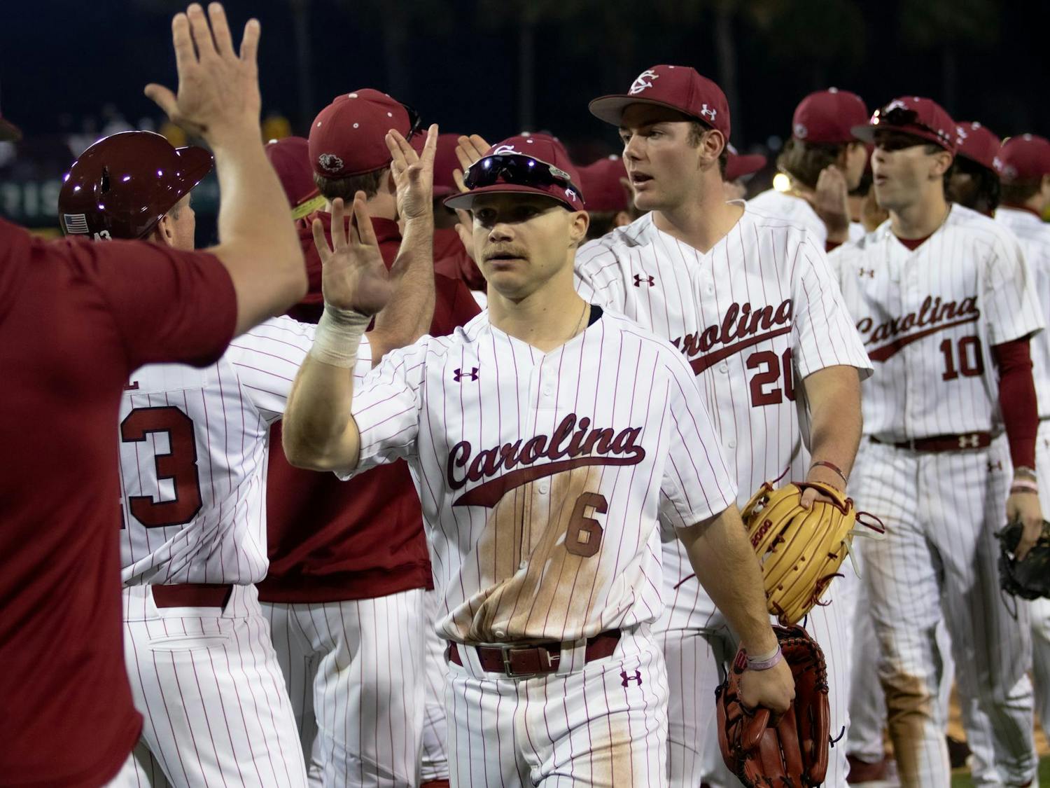 Junior outfielder Blake Jackson high-fives his teammates after the Gamecocks' 5-1 victory over Miami-Ohio on Feb. 16, 2024 at Founders Park. Jackson totaled three hits during the Gamecocks' opening weekend series.