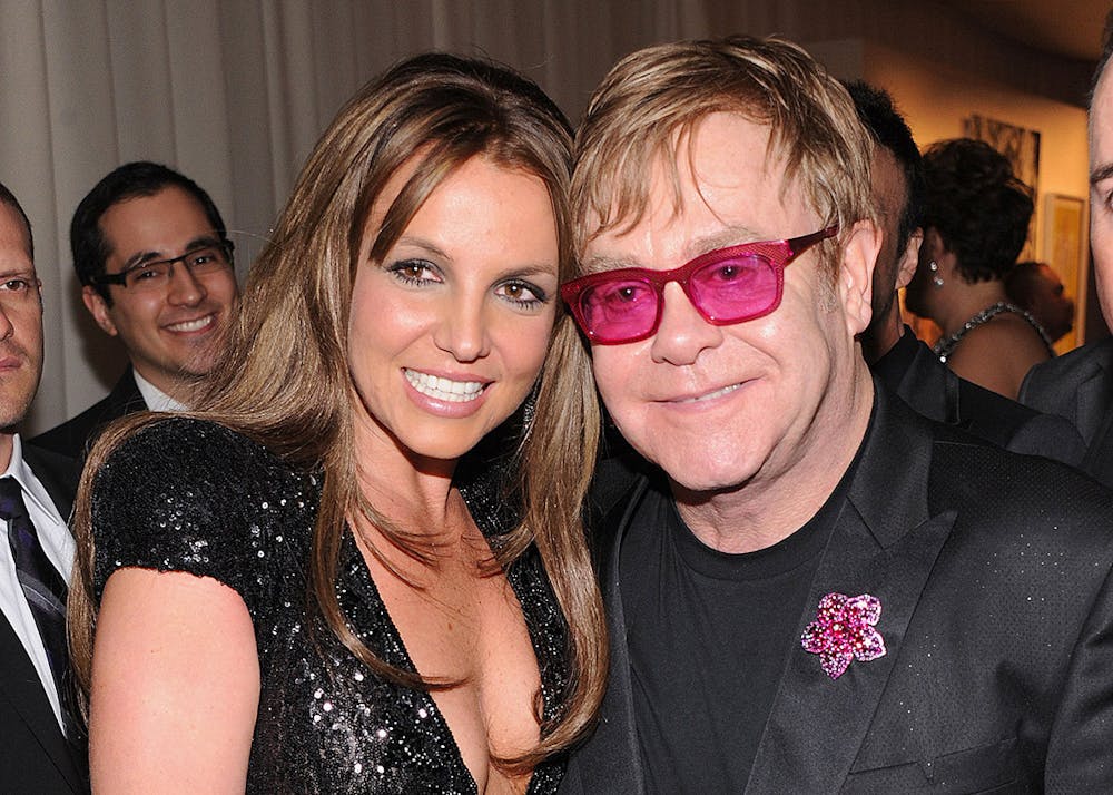Britney Spears, left, and Elton John attend the 21st Annual Elton John AIDS Foundation Academy Awards Viewing Party at West Hollywood Park on Feb. 24, 2013, in West Hollywood, California. (Jamie McCarthy/Getty Images for EJAF/TNS)