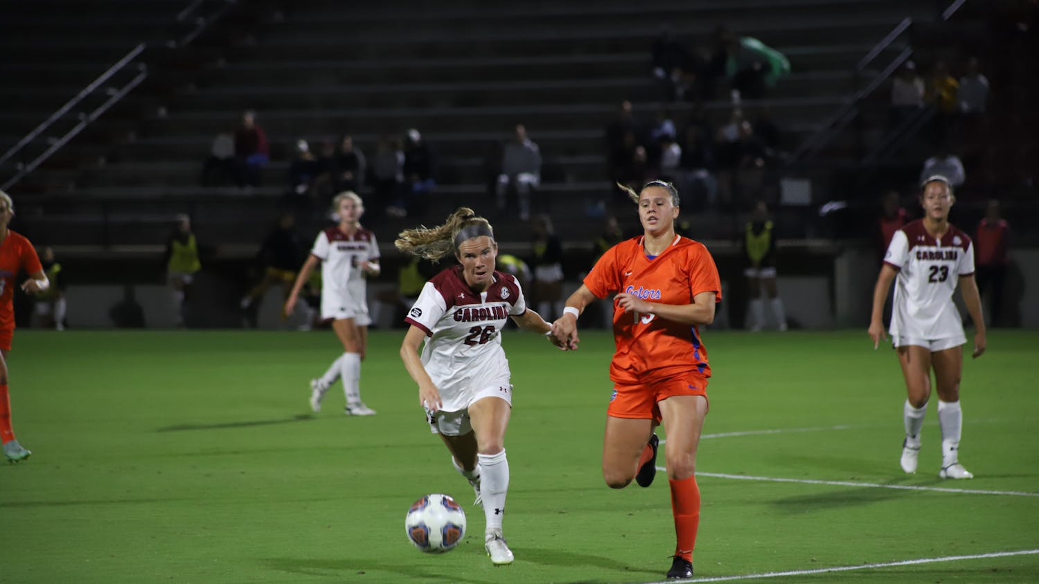 FILE—Redshirt senior midfielder Claire Griffiths races down the field to claim the ball before her Florida opponent during a game on Sept. 28, 2022.