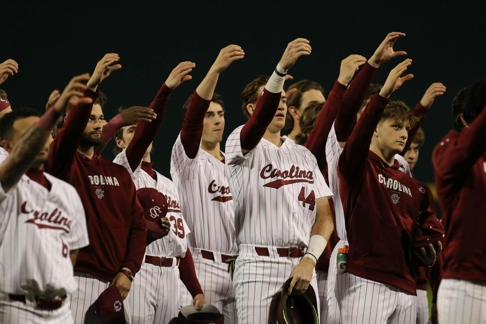FILE – South Carolina baseball players participate in the school’s alma mater after an 8-1 victory against Belmont on Feb. 23, 2024. The Gamecocks are 6-0 on the season.