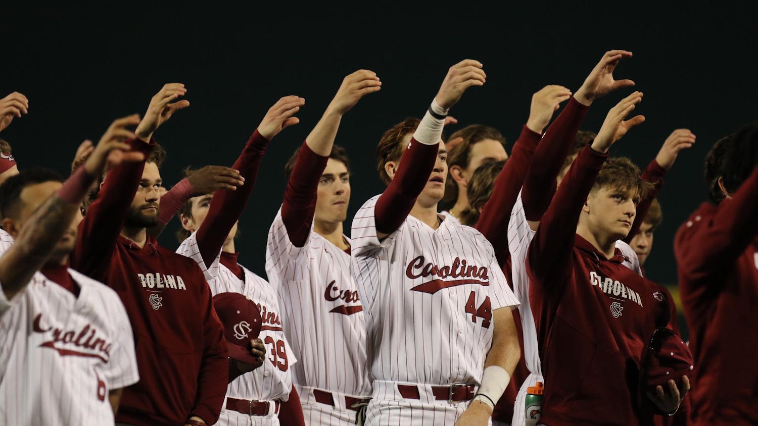 FILE – South Carolina baseball players participate in the school’s alma mater after an 8-1 victory against Belmont on Feb. 23, 2024. The Gamecocks are 6-0 on the season.
