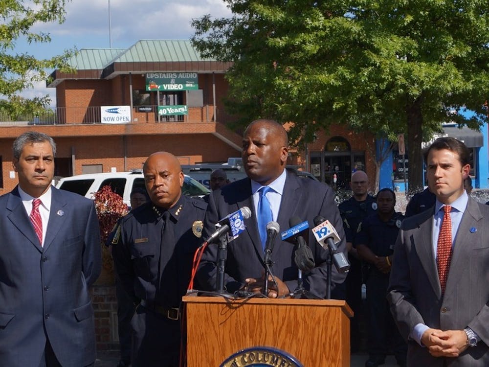 Columbia Police Chief Randy Scott (left) and Mayor Steve Benjamin announced their plans to curb violence and other crime in Five Points at a Thursday afternoon press conference.