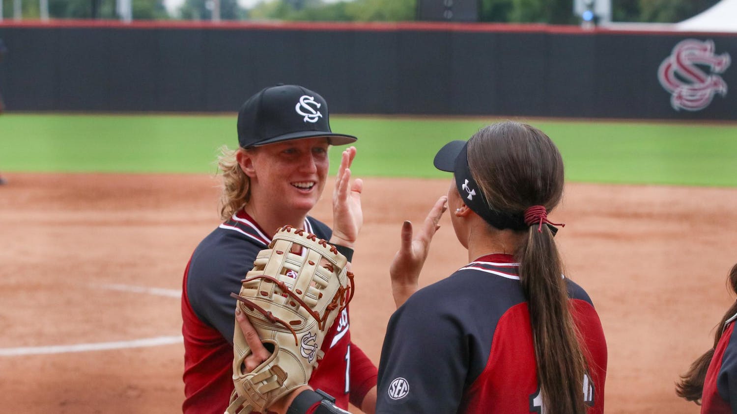 FILE — Senior catcher Jamie Mackay (left) and senior infielder Arianna Rodi (right) celebrate after an inning at Beckham Field on Sept. 28, 2025. The Gamecocks played in their Garnet & Black World Series on Oct. 28, 2025, at Beckham Field, with the Black team winning.