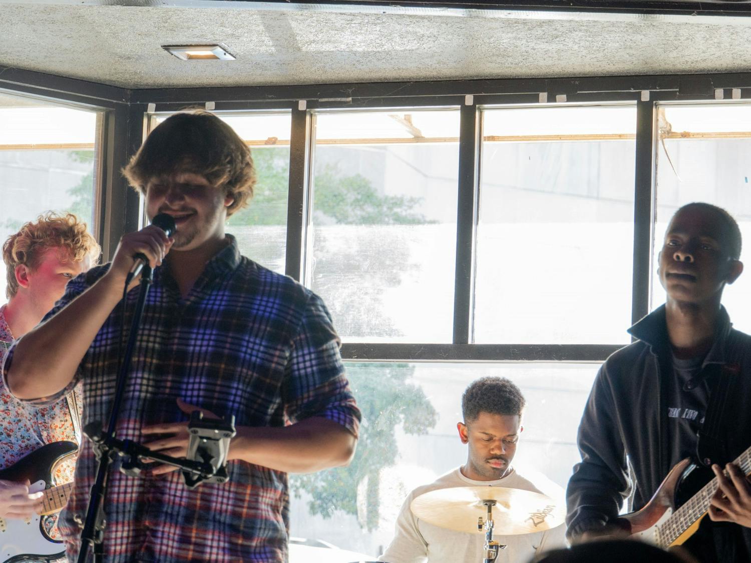 Local band Outta Pocket performs at The Joint on Main 1710, a local jazz and tapas restaurant in Columbia, South Carolina on March 25, 2022. Rex Hagins, Outta Pocket’s guitarist, recommends emerging artists to engage and be active within their community.