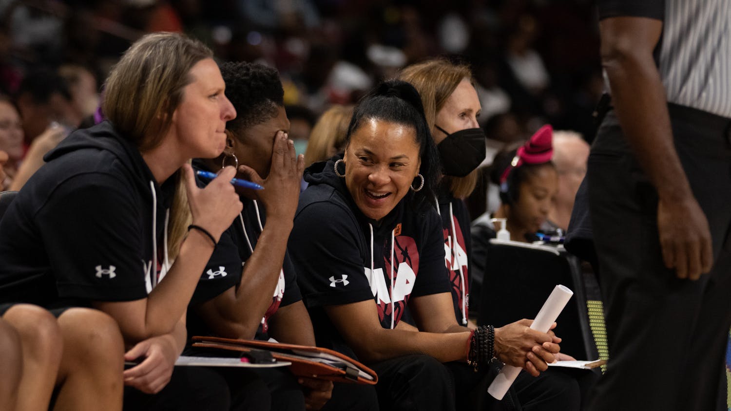 Head coach Dawn Staley laughs with the coaching staff during the exhibition game against Benedict College at Colonial Life Arena on Oct. 31, 2022. South Carolina scored the most points in an exhibition game in program history in the 123-32 win over Benedict.&nbsp;