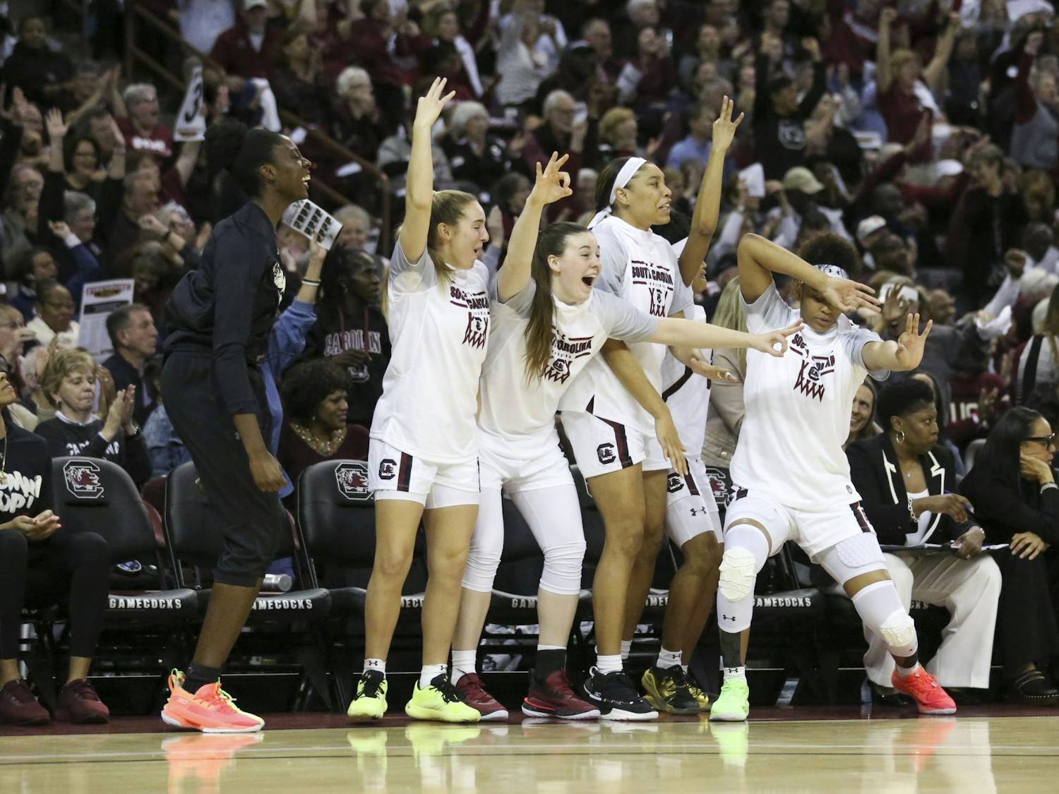South Carolina’s bench celebrates after one of its players scored a 3-point shot during the second half. The Gamecocks had multiple 3-point shots to start the second half.