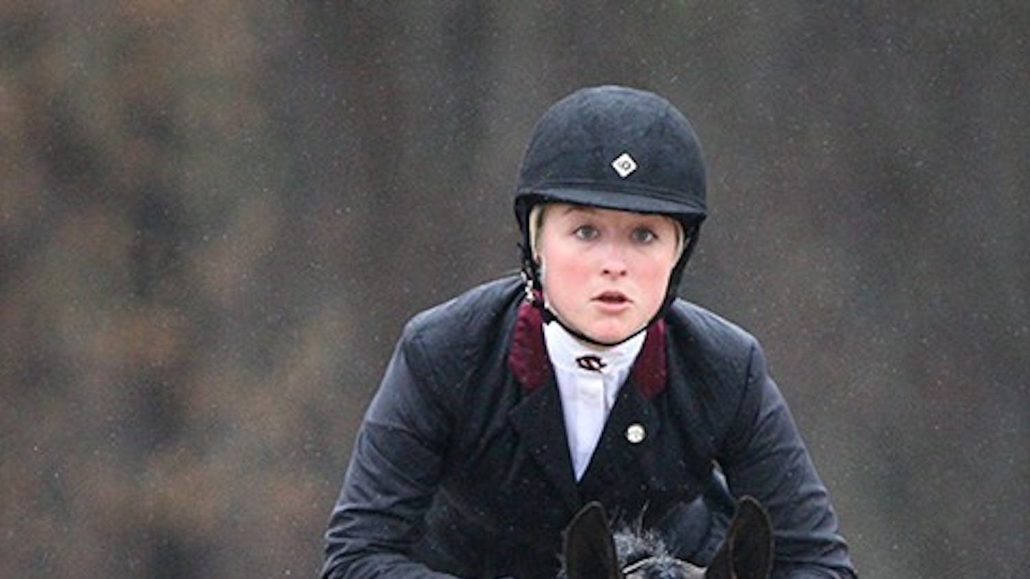 South Carolina's Amber Henter competes in Equitation Over Fences during the SEC Equestrian championships against Georgia at One Wood Farm in Blythewood, S.C., Saturday, March 29, 2014. (C Michael Bergen/The State/MCT)