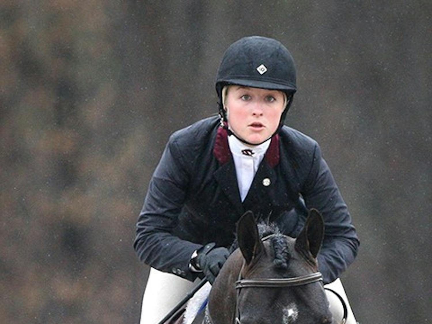 South Carolina's Amber Henter competes in Equitation Over Fences during the SEC Equestrian championships against Georgia at One Wood Farm in Blythewood, S.C., Saturday, March 29, 2014. (C Michael Bergen/The State/MCT)