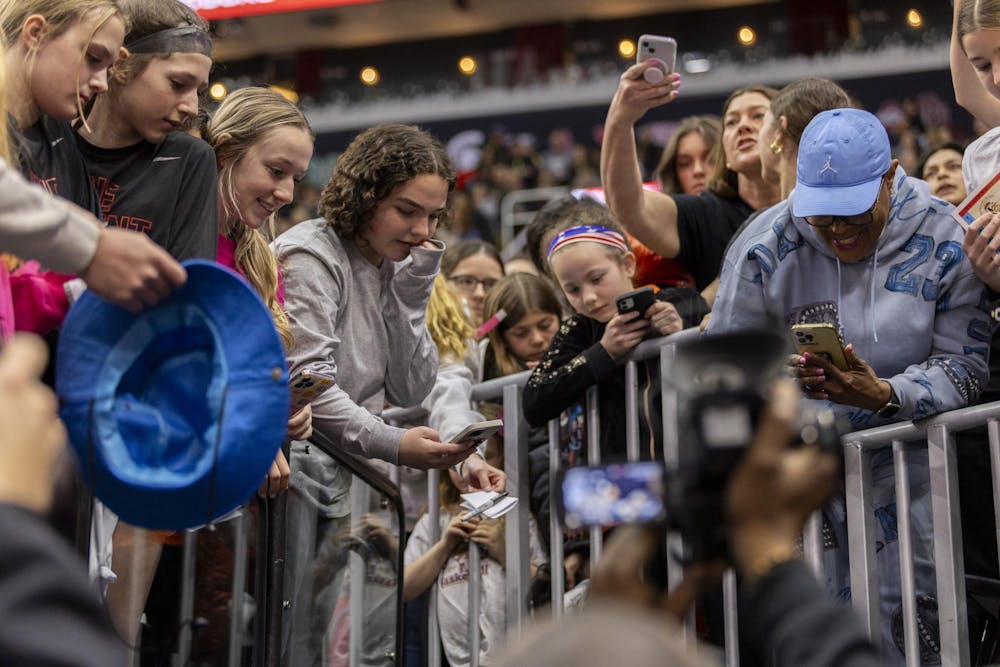 <p>Basketball fans interact with ɫɫƵ head coach Dawn Staley during the team's open practice on April 6, 2024, ahead of the national championship game at Rocket Mortgage FieldHouse. Staley signed autographs and took selfies with fans during the sold-out open practice.</p>