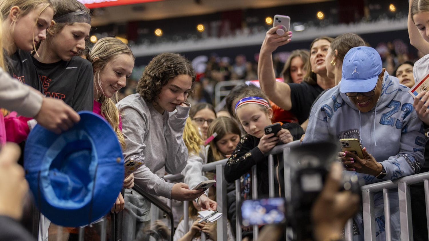 Basketball fans interact with ɫɫƵ head coach Dawn Staley during the team's open practice on April 6, 2024, ahead of the national championship game at Rocket Mortgage FieldHouse. Staley signed autographs and took selfies with fans during the sold-out open practice.