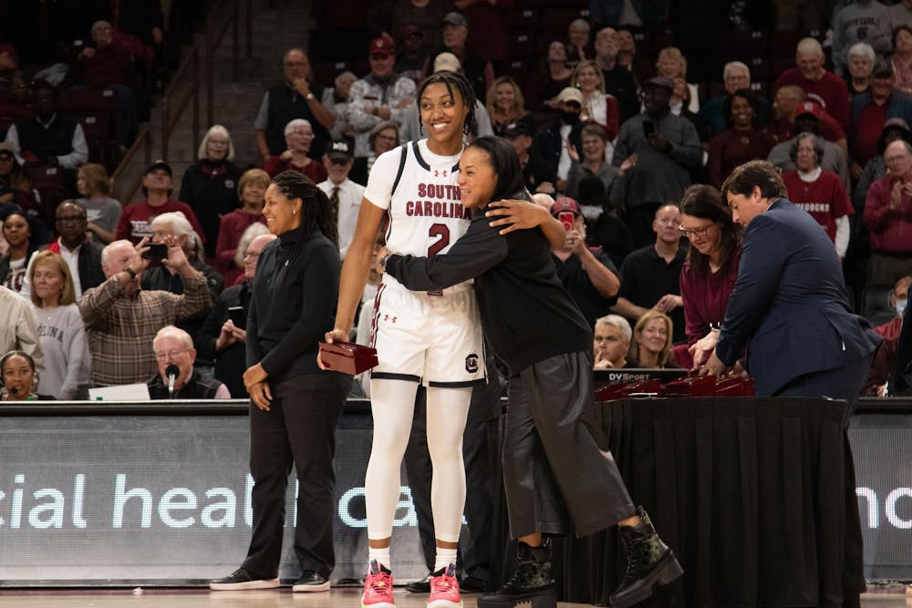 <p>FILE — Sophomore forward Ashlyn Watkins and head coach Dawn Staley share a hug during a ring presentation ceremony for the Gamecocks' SEC Championship and Final Four appearance in the 2022-23 season. The ceremony was held at Colonial Life Arena following South Carolina's 114-76 victory over Maryland on Nov. 12, 2023.</p>